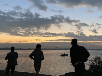 Sunset silhouette of runners jogging side by side, embodying teamwork and perseverance