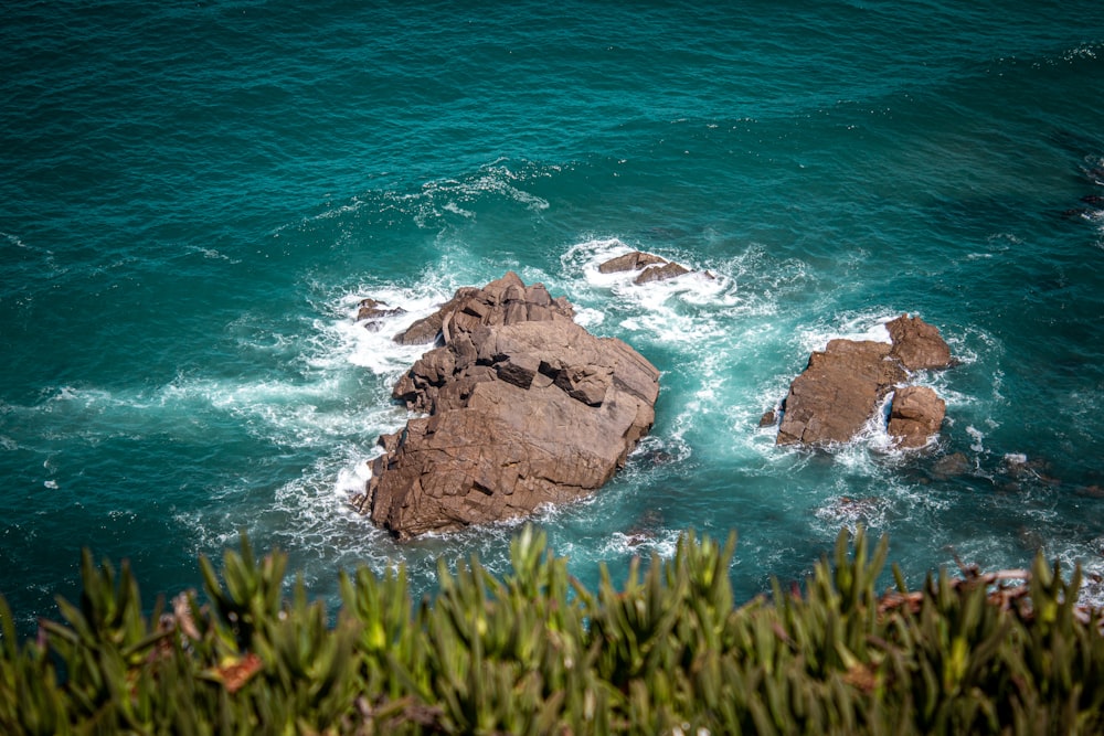 a group of rocks in the water