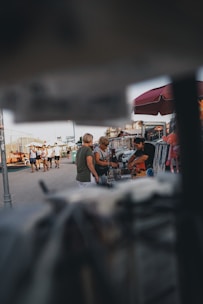 A friendly meeting in a sunny Sebring park where jewelry is being appraised.