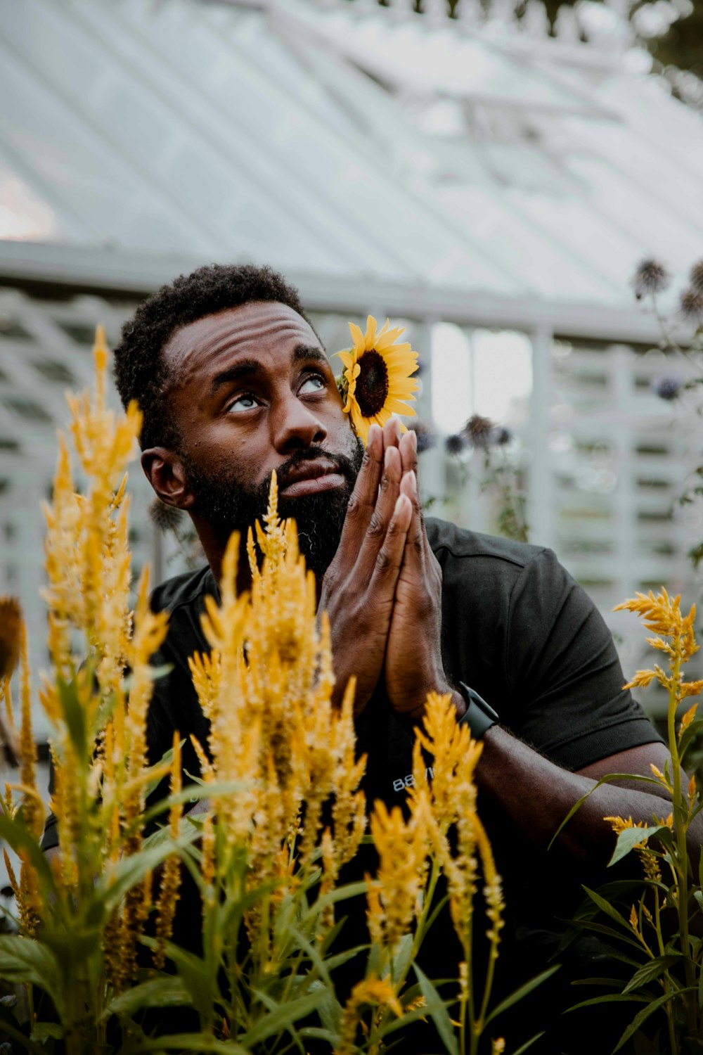 a man holding a flower