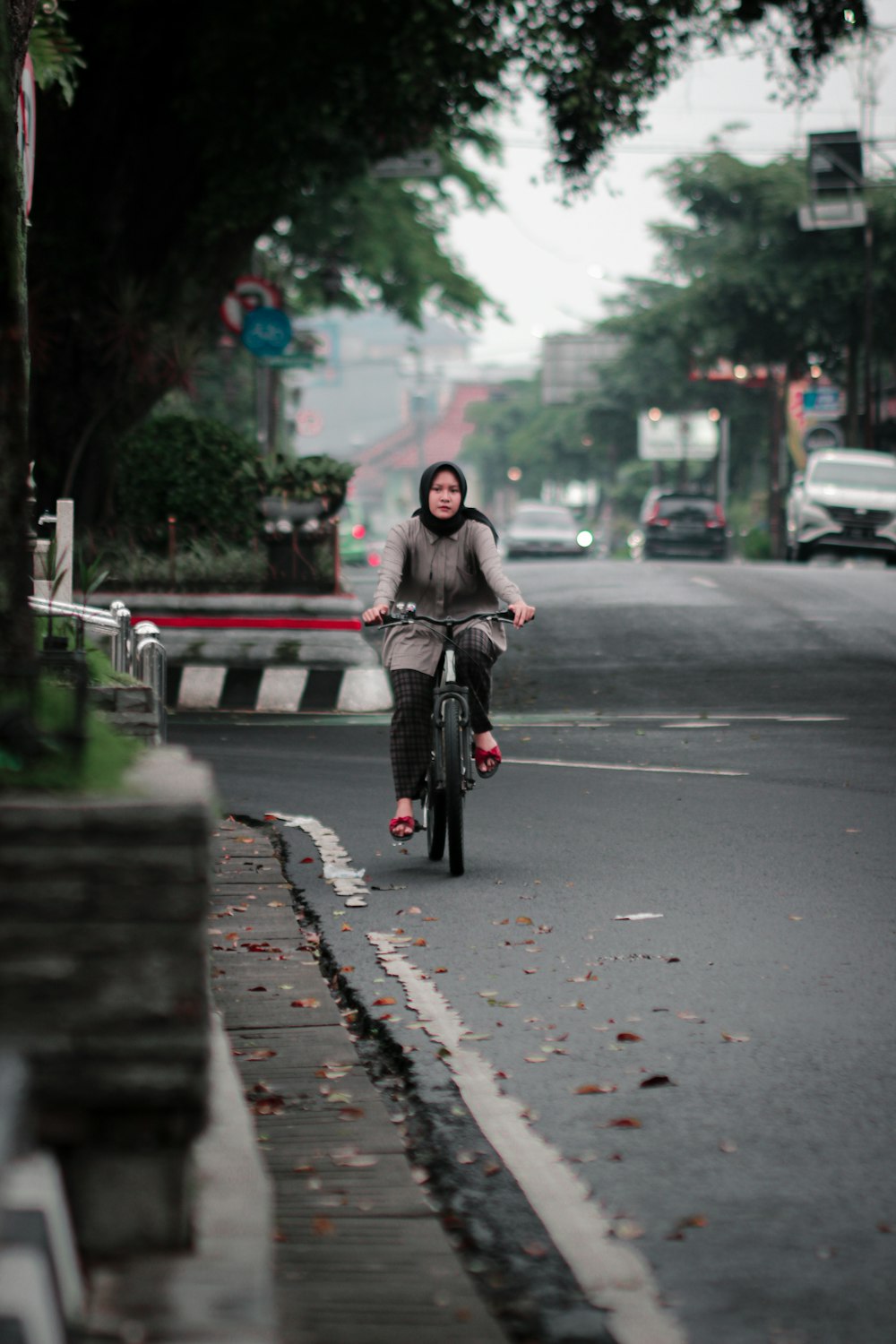 a person riding a bicycle on a street