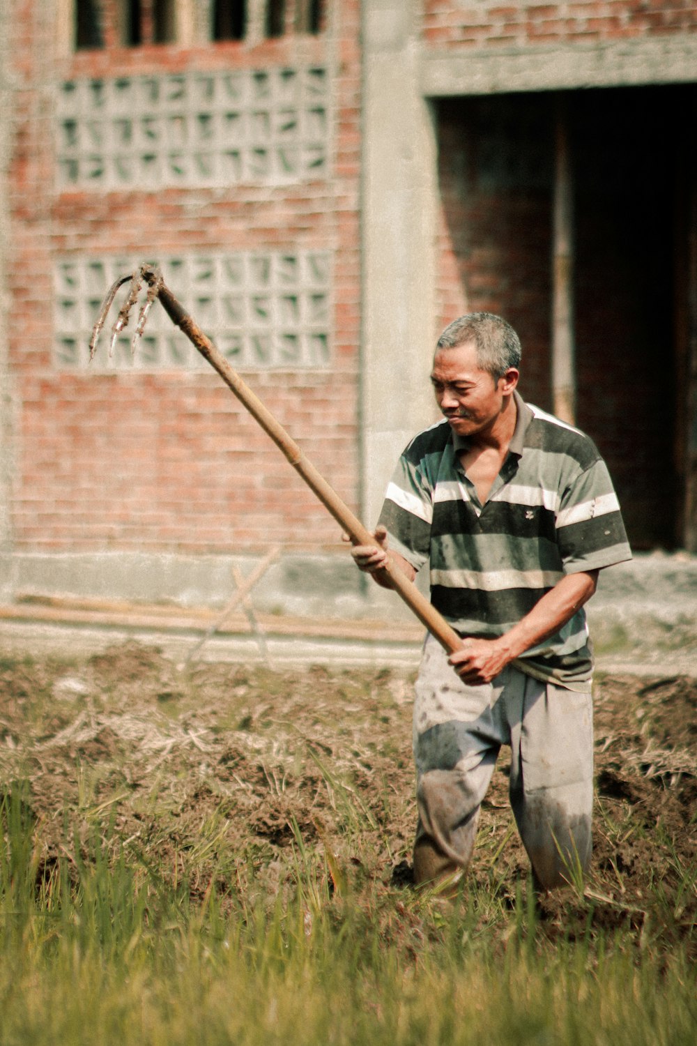 a man holding a stick