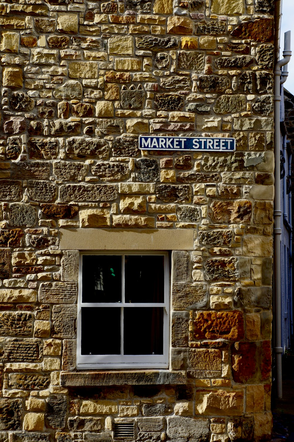 a fire place sitting in front of a brick building