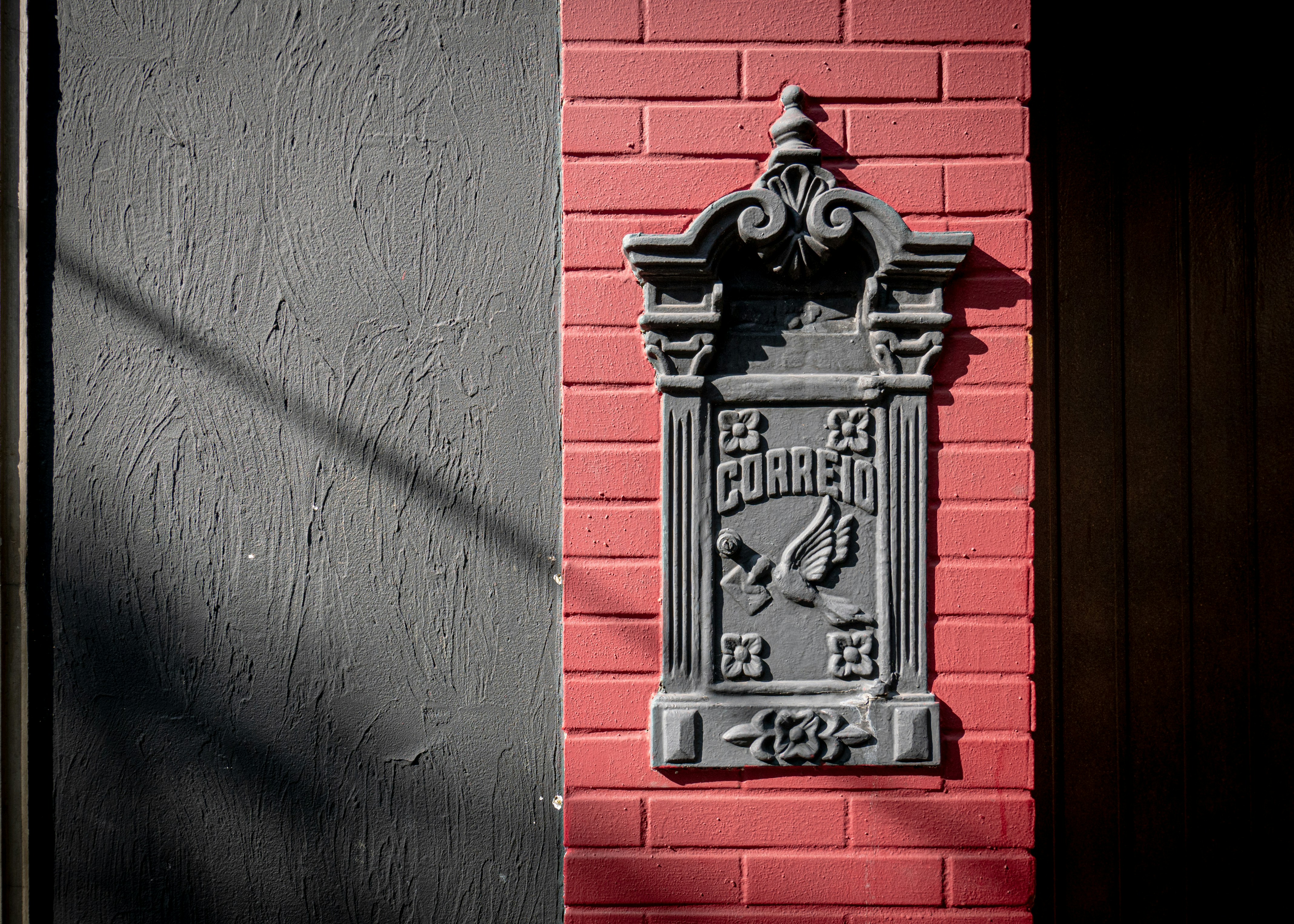 a sign on a brick wall