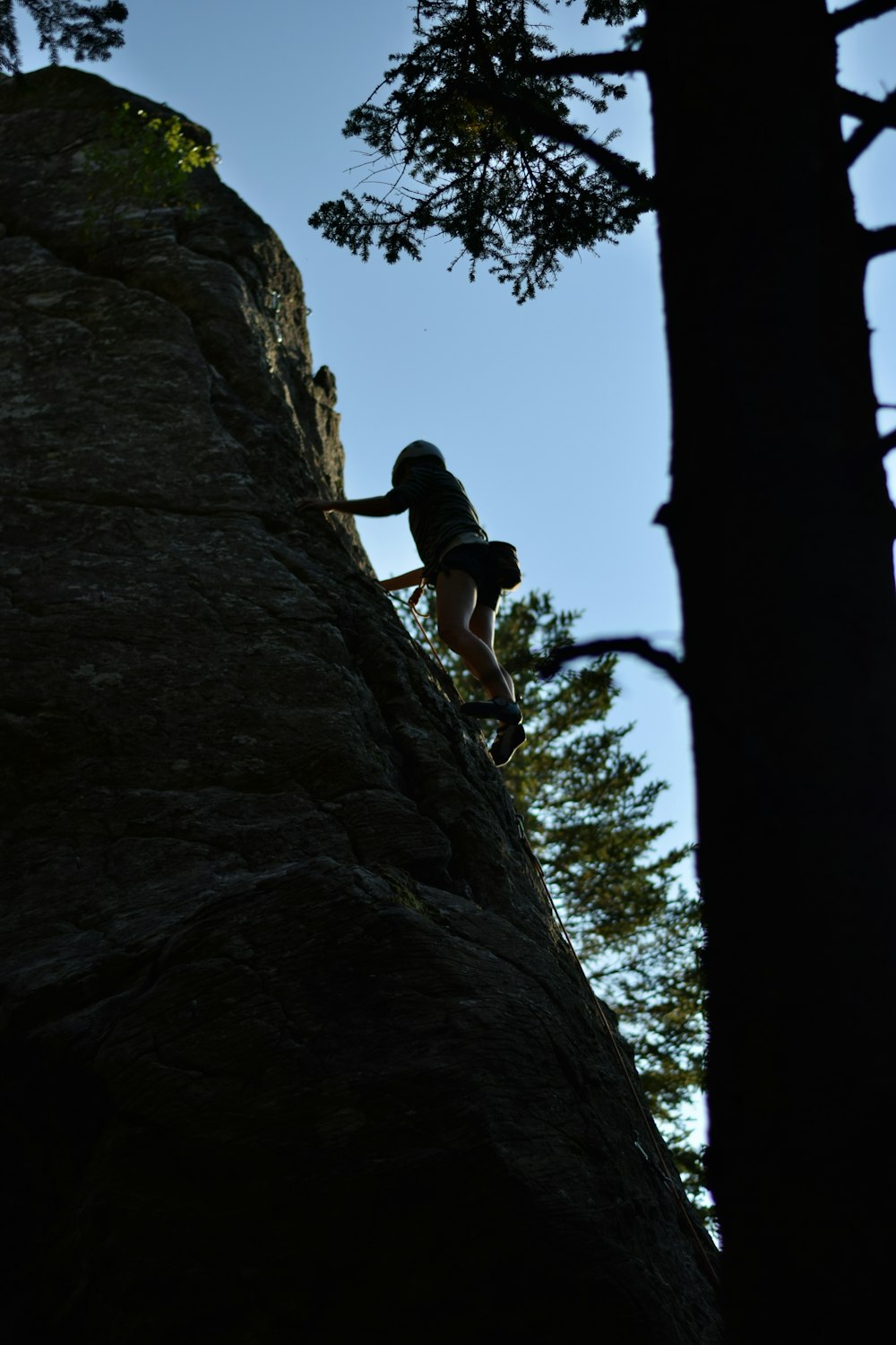 a person climbing a rock