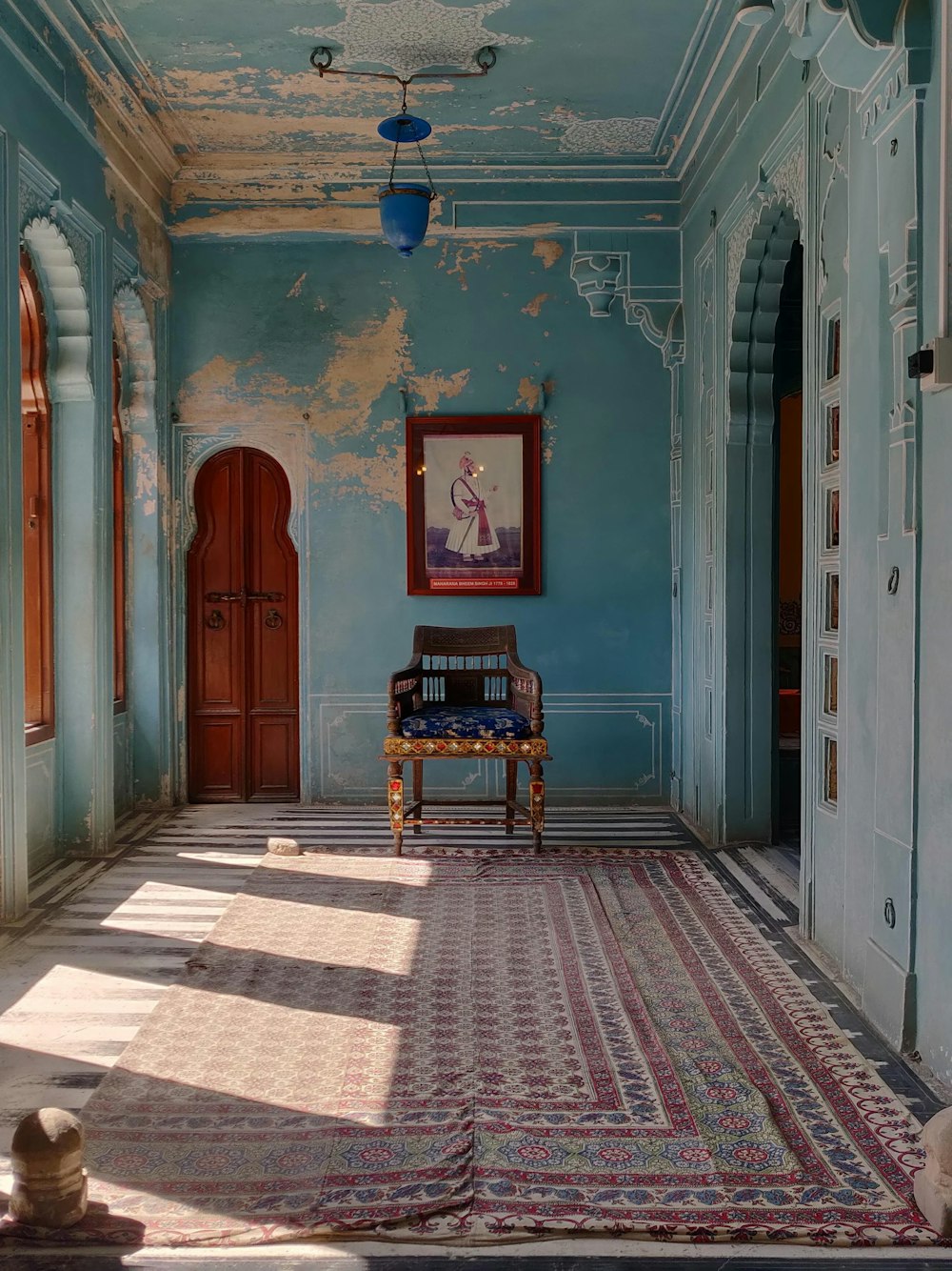 a room with a chair and a rug