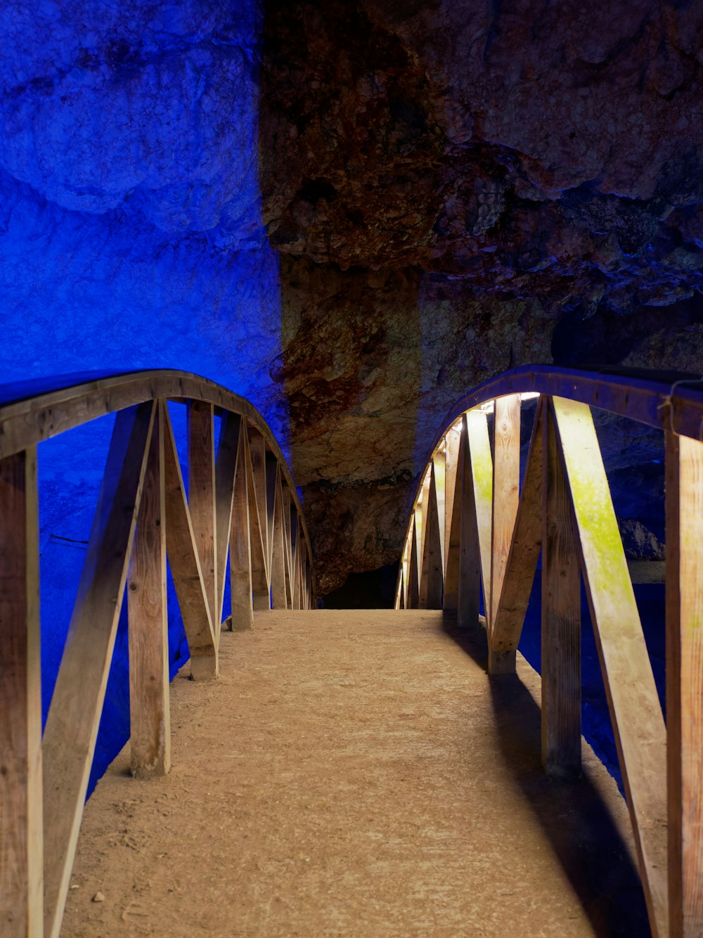 a wooden staircase in a cave