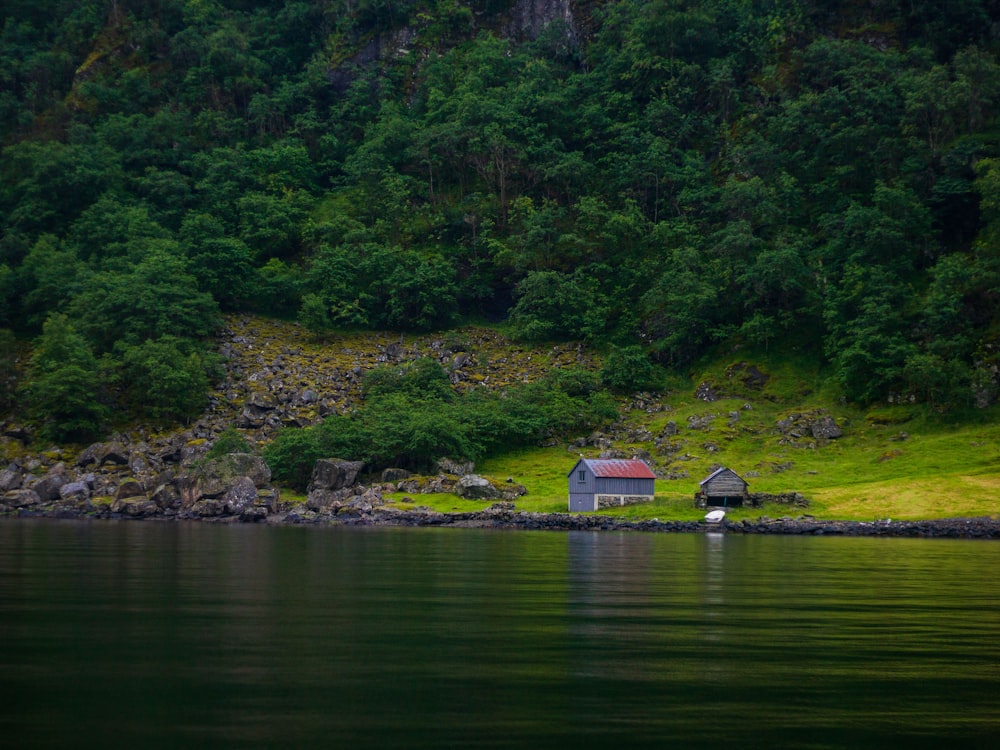 a small house on a rocky island
