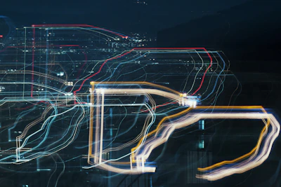 Abstract tech-inspired light trails weaving through a modern urban skyline at night.