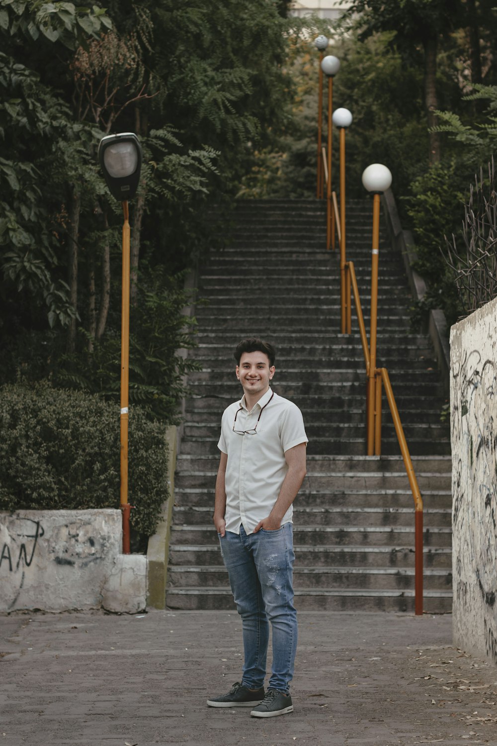 a man standing on a sidewalk