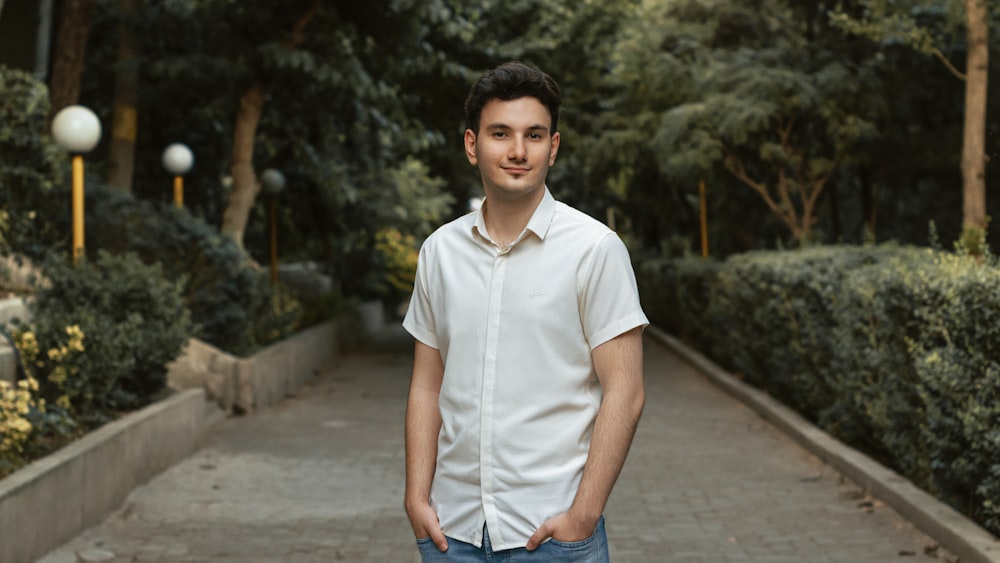 a man standing on a sidewalk