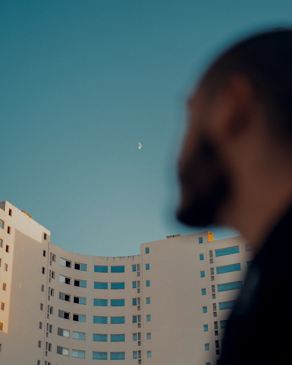 a person looking at a tall building