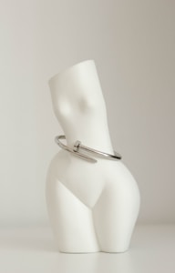 a white lamp with a silver shade