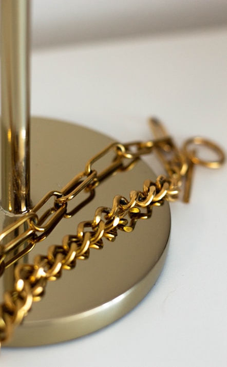 a pair of gold earrings