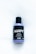 A bottle of Lush Sleepy shower gel is placed on a light surface. The label is primarily black with bold white text, featuring the name 'Sleepy' and product details beneath it. The bottle is a light lavender color and has a black cap.