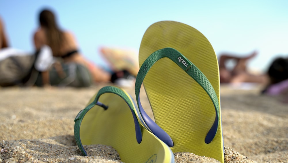 a pair of tennis rackets on a beach