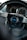 A close-up view of a car steering wheel, prominently featuring a brand logo labeled 'personal' in the center. The dashboard in the background shows the speedometer and other gauges.