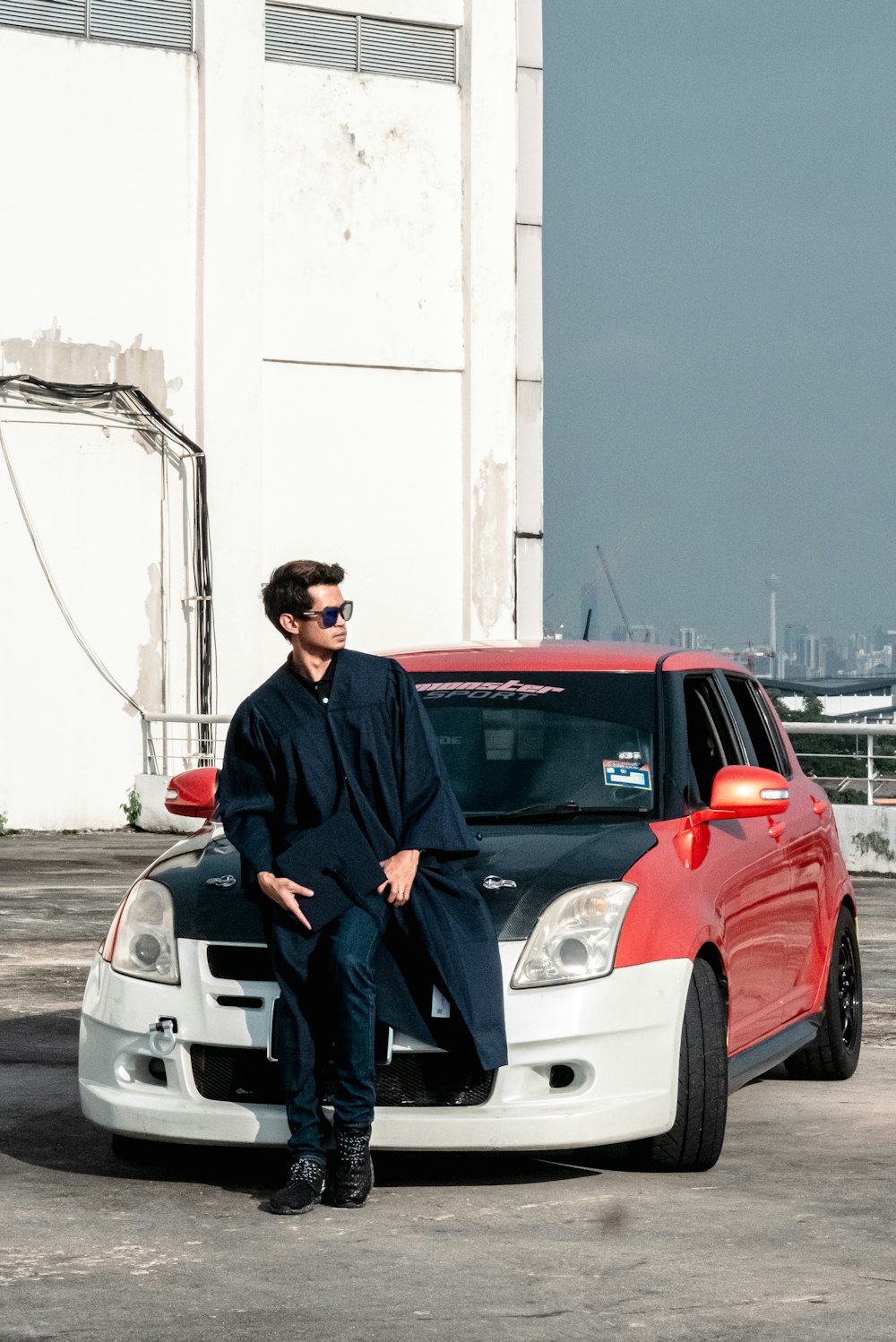 a man sitting on a car