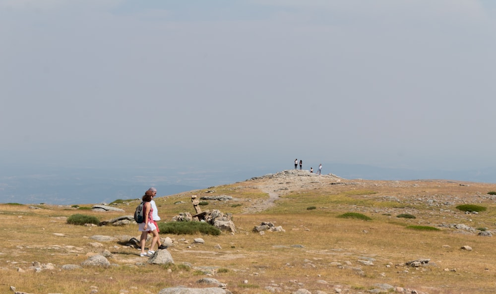 a person sitting on a rock