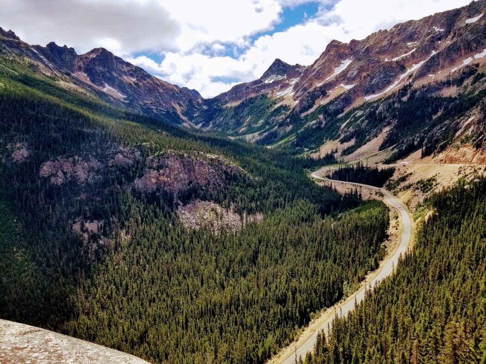 a winding road through a valley