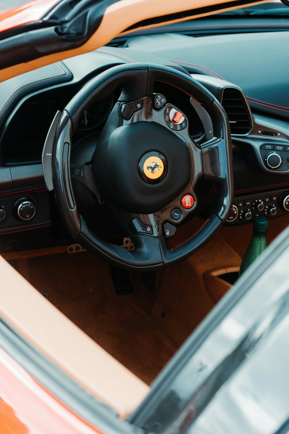 the steering wheel and dashboard of a car