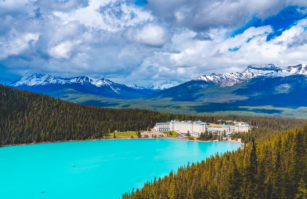 a lake surrounded by mountains and trees