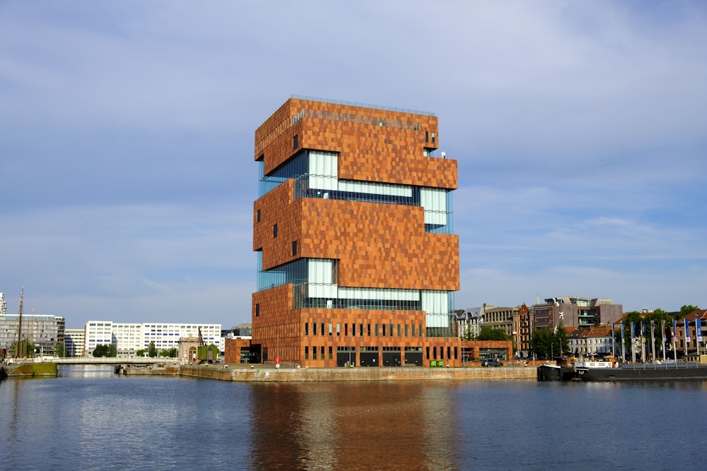 Museum aan de Stroom next to a body of water