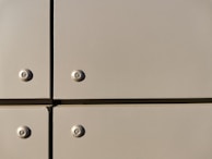 Close-up of a bracket’s mounting holes and smooth powder-coated surface.