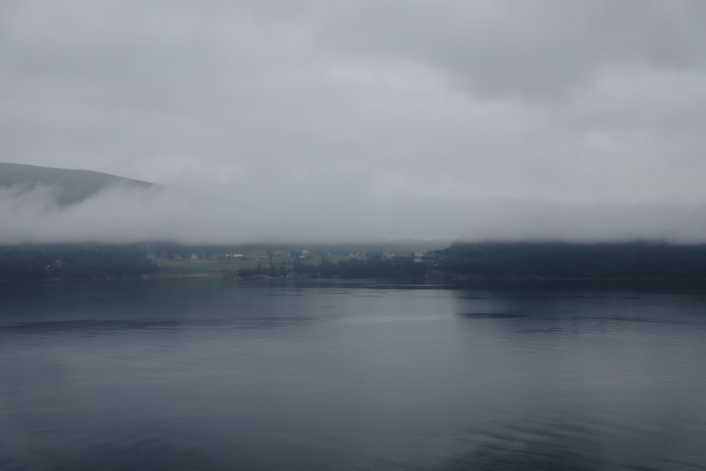 a body of water with a city in the distance