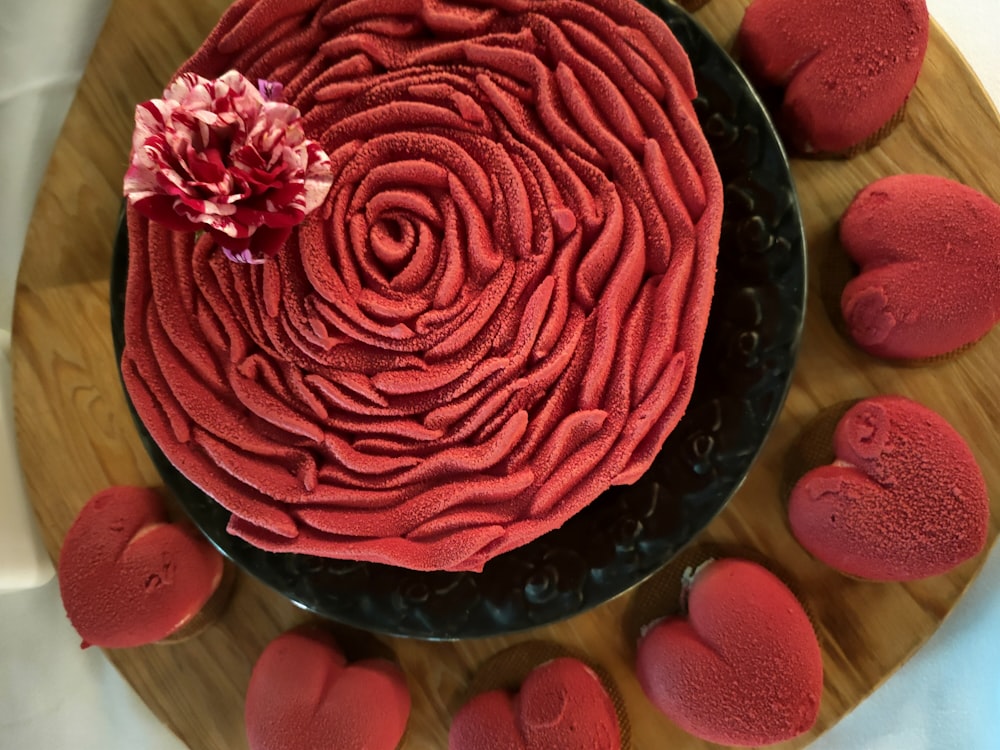 a cake with red frosting