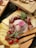 A close-up of assorted cheeses and cold cuts on a wooden board.