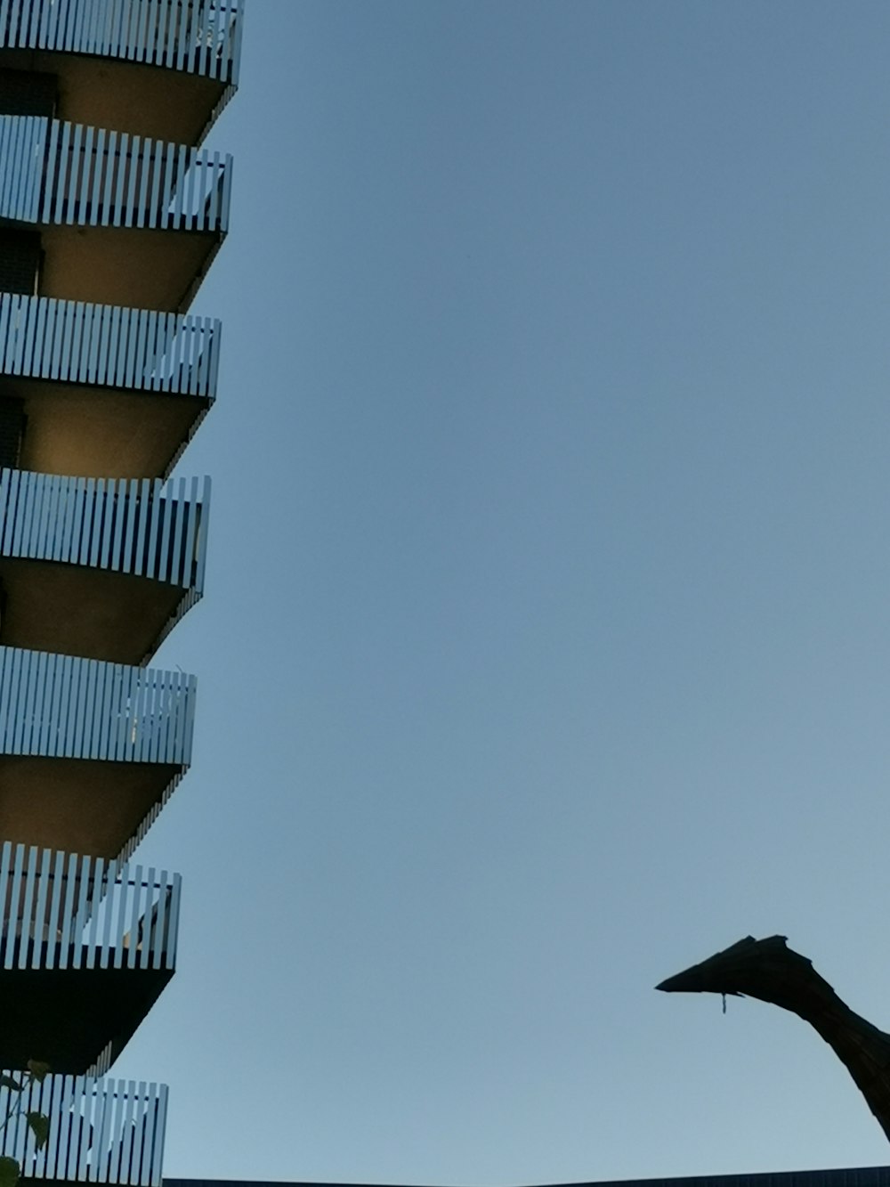 a tall building with a balcony