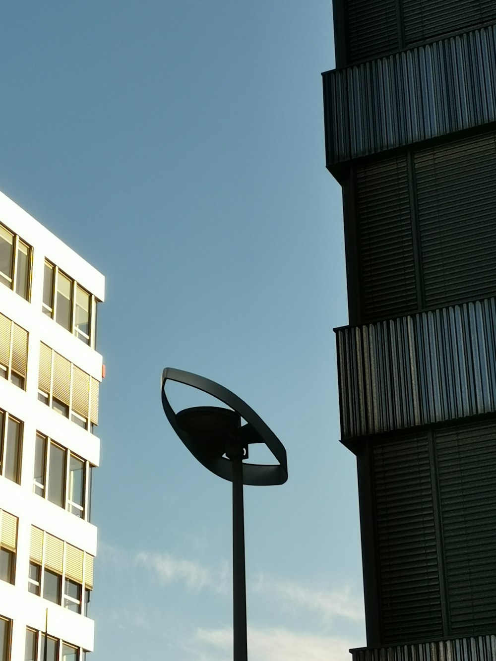 a lamp post in front of buildings
