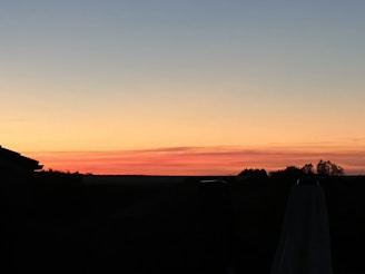 A book cover featuring a romantic sunset.