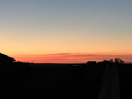 A book cover featuring a romantic sunset.