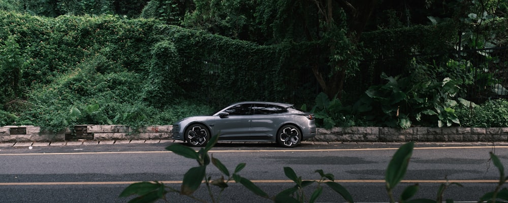 a silver car parked on a road