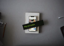 Close-up of a smartphone displaying the Flip app interface with a call button.