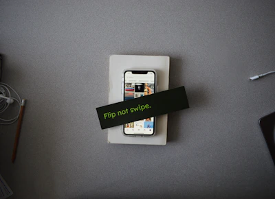 Close-up of a smartphone displaying the Flip app interface with a call button.