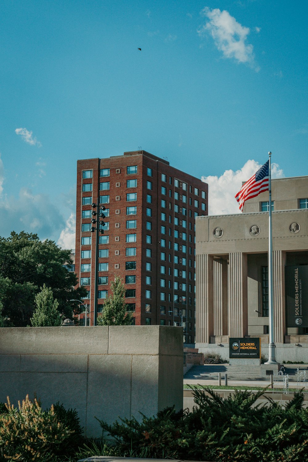 a flag on a pole in front of a building