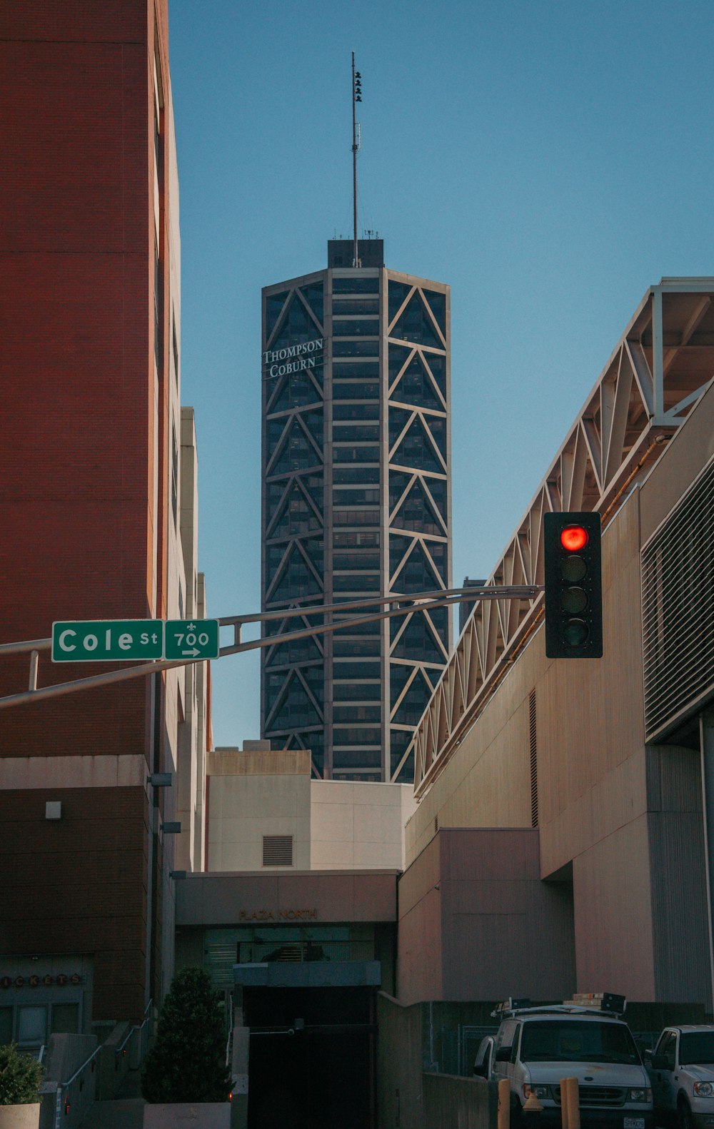 a traffic light towers over a city