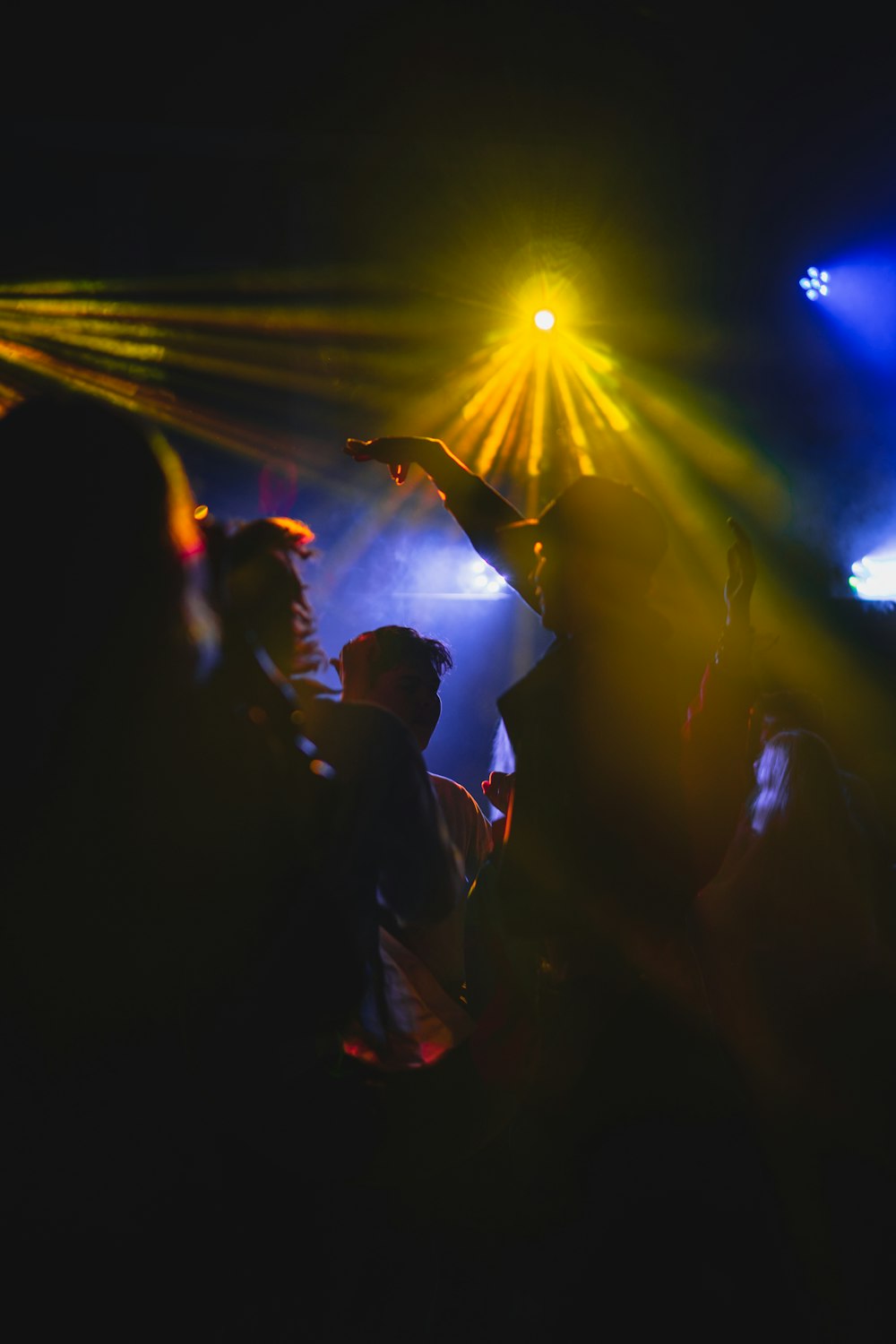 a group of people holding a light up in the air