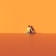 A lone figure with a minimalist and abstract appearance sits against a flat, seamless orange background. The figure wears a small, black, triangular hat, casting a shadow on the ground. The scene conveys a sense of solitude or introspection in a surreal, dreamlike environment.