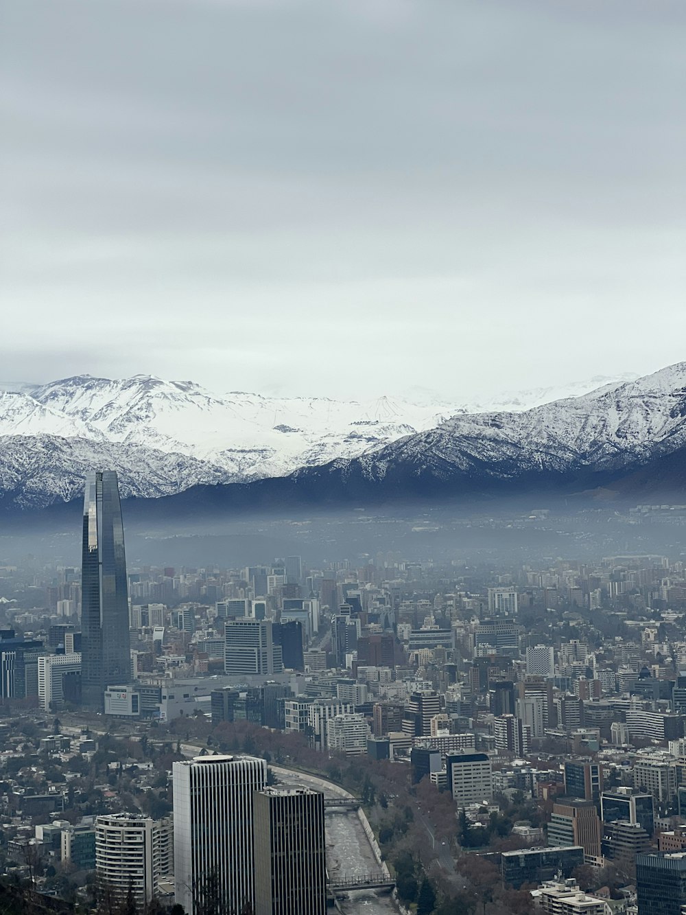 a city with snow covered mountains
