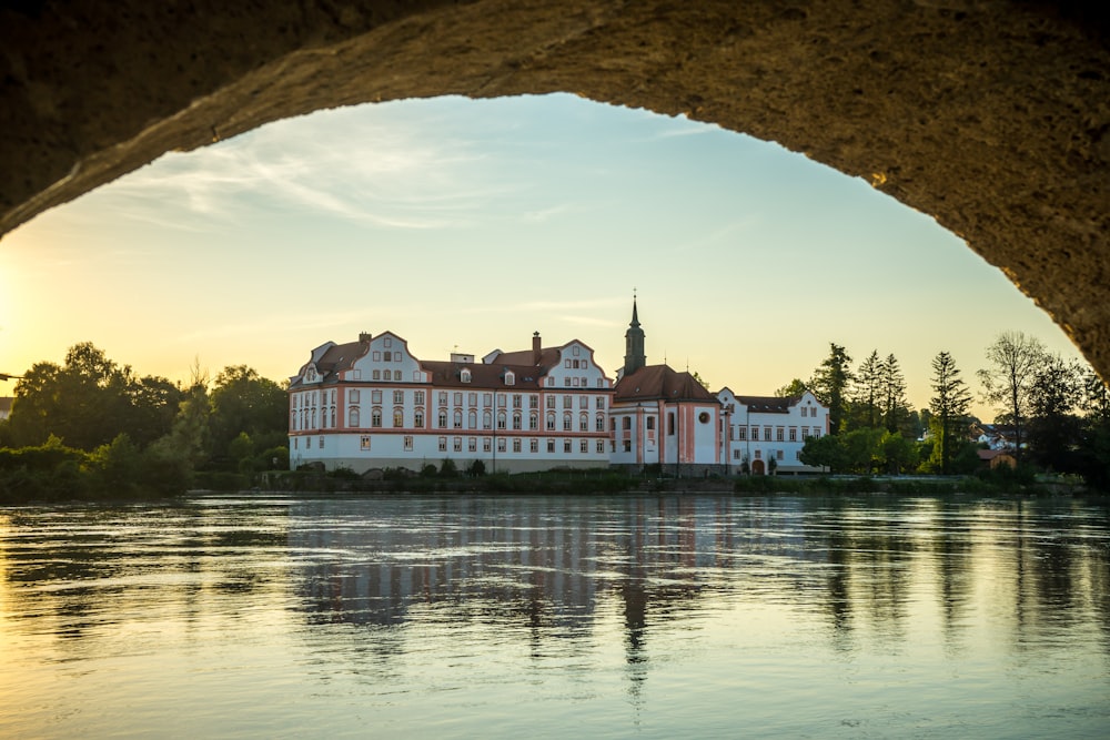 a large building with a body of water in front of it