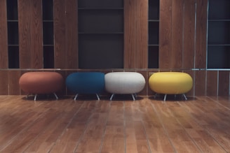 Chic pouf ottomans in various colors.