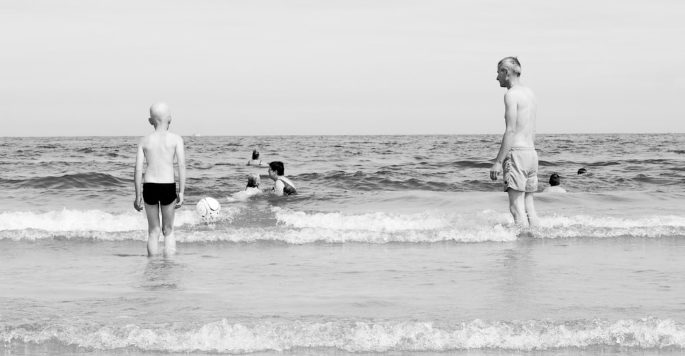 a group of people play in the ocean