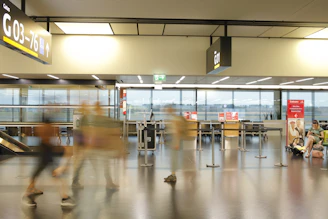 Airport terminal concourse representing coordinated mobility options.
