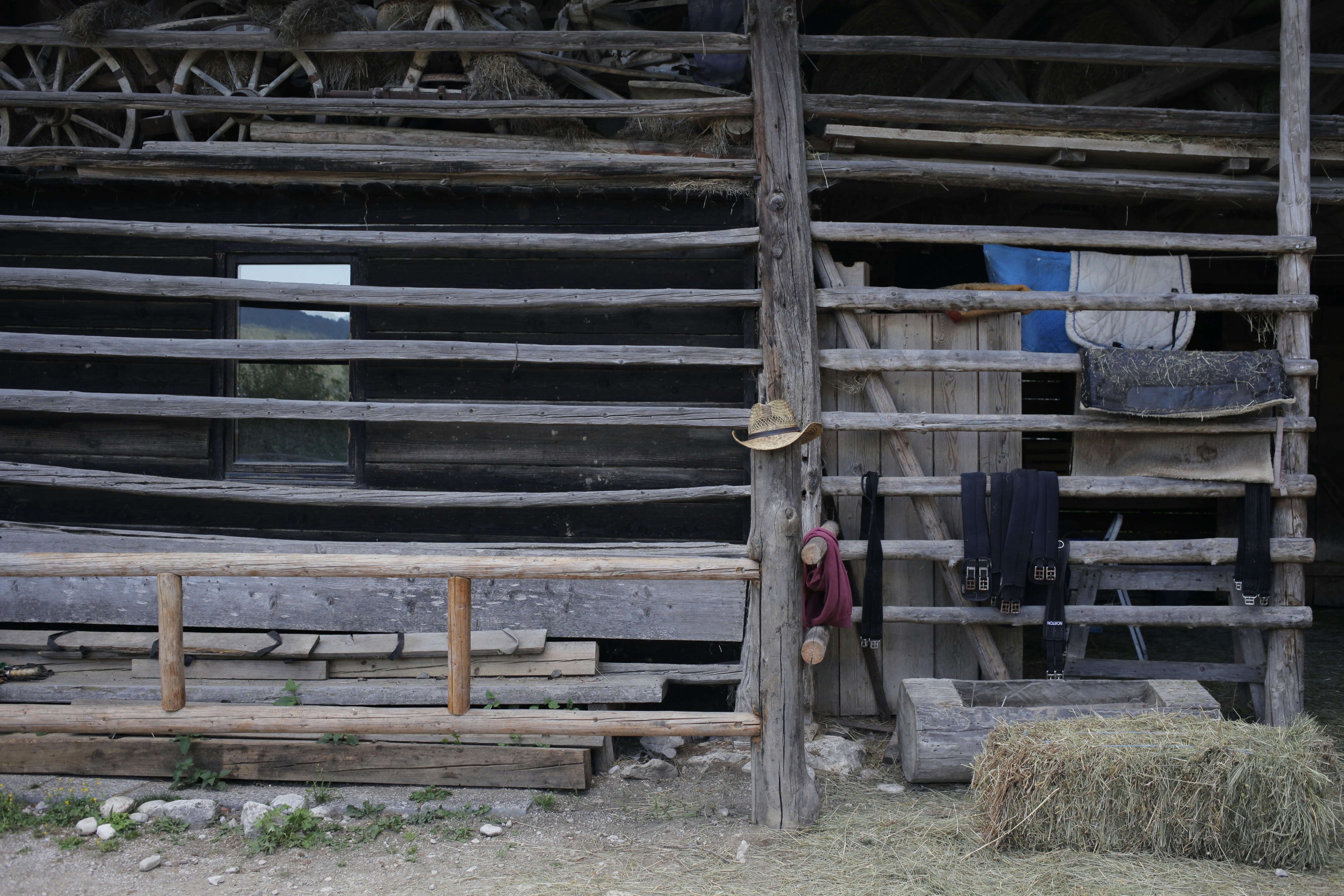 a wooden building with a fence