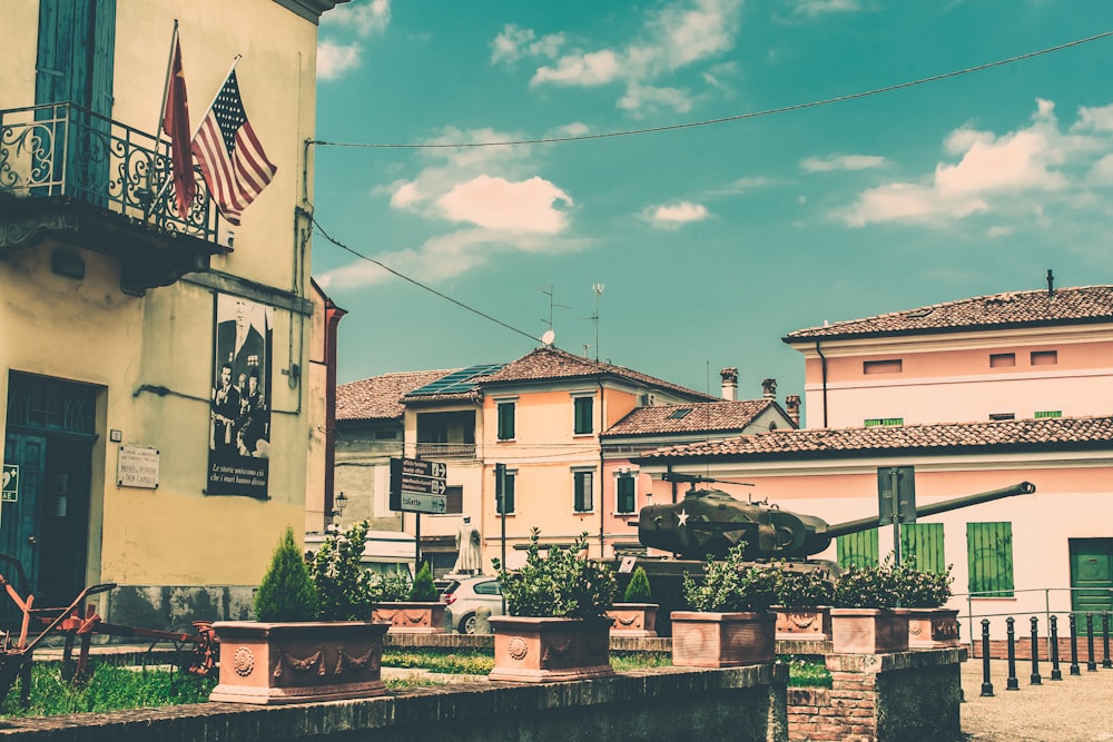 a row of buildings with a flag