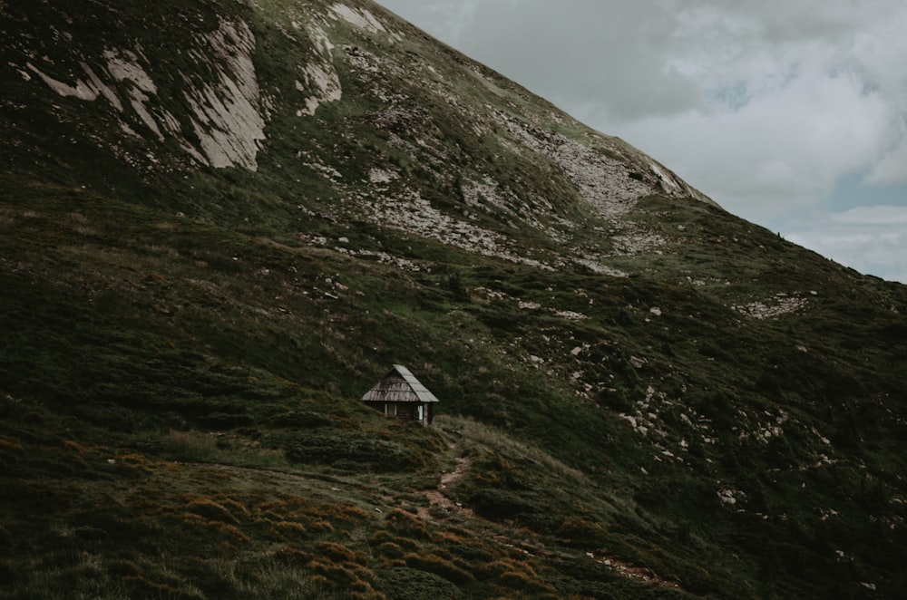 a small house on a hill